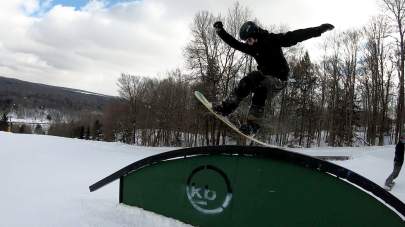 Terrain Park snowboarder on rail