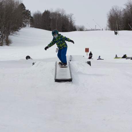Young snowboarder in Terrain Park